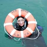 Diver having fun during her scuba diving training